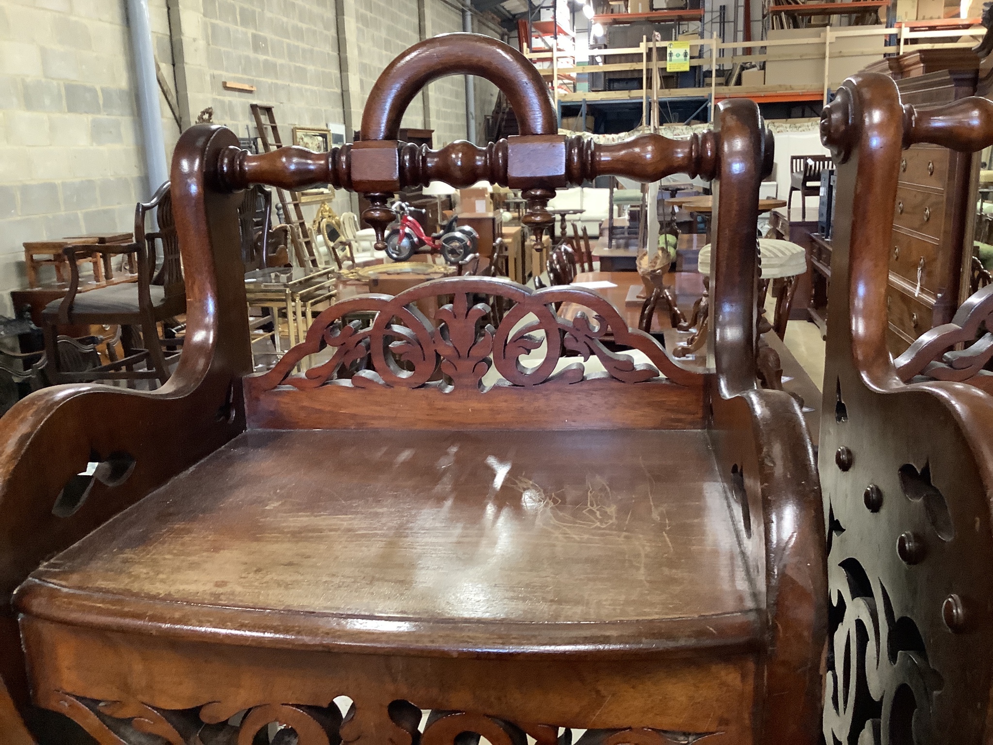 A pair of Victorian style mahogany hall seats in the manner of Shoolbred. W-47, D-38, H-76cm.